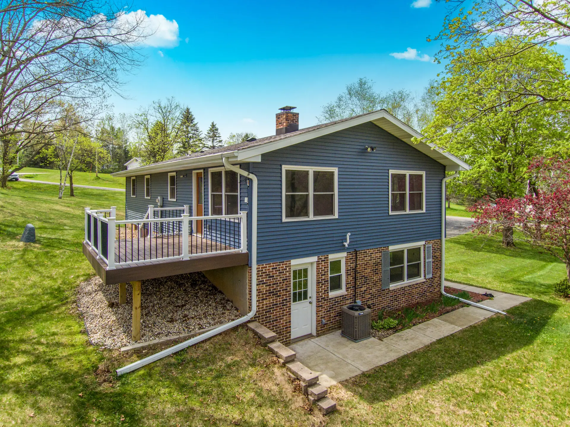 Back of house with deck
